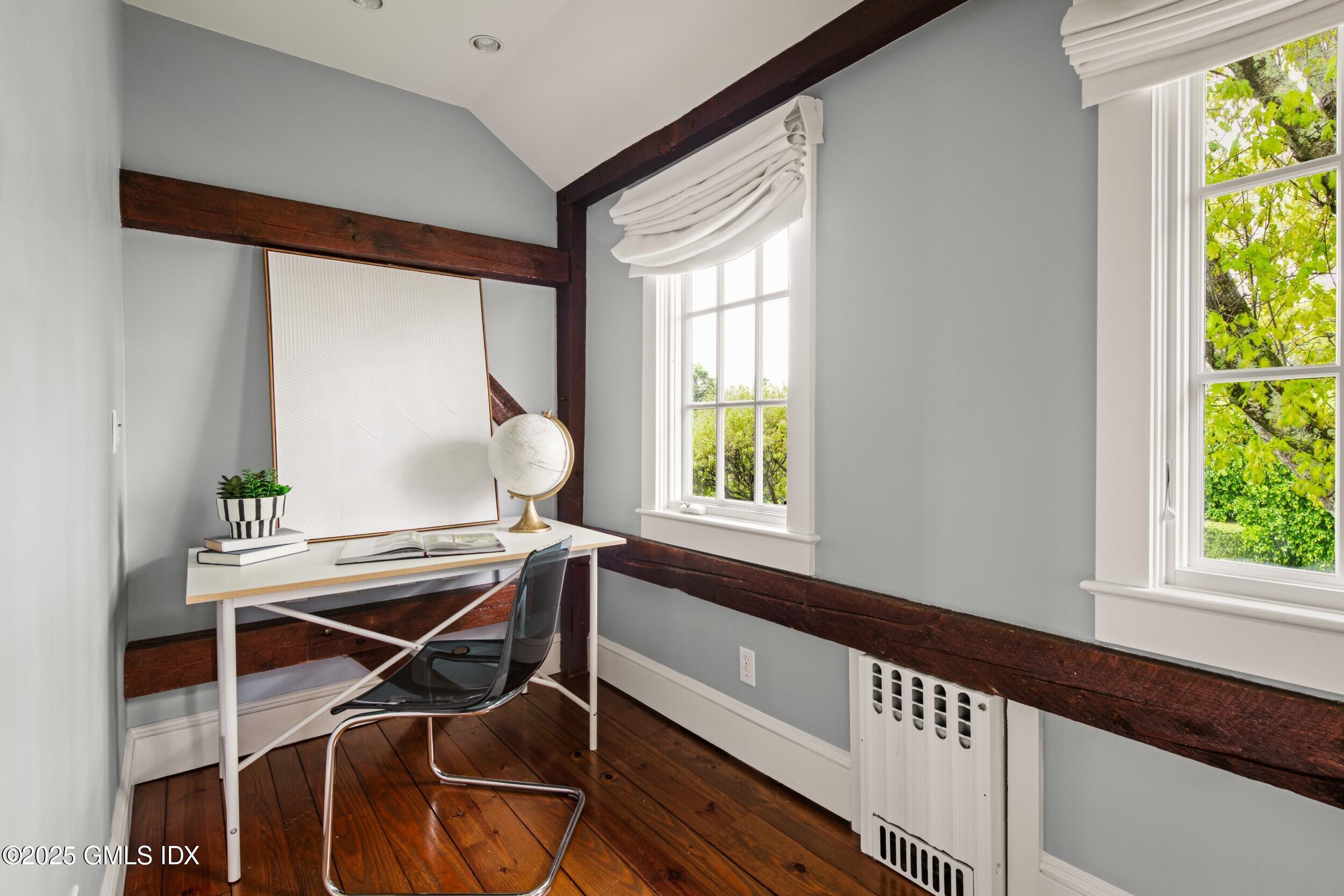 945 Oenoke Ridge New Canaan, CT 06840 - Photo 57 of 94 a room with a table and a window