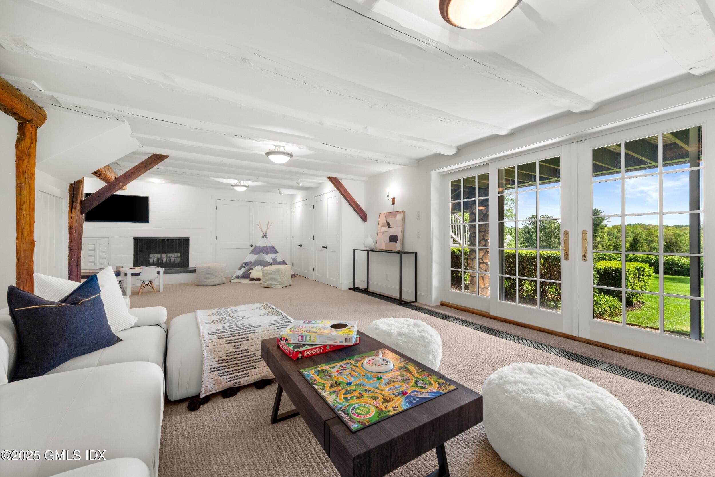 945 Oenoke Ridge New Canaan, CT 06840 - Photo 59 of 94 a living room with furniture and a large window