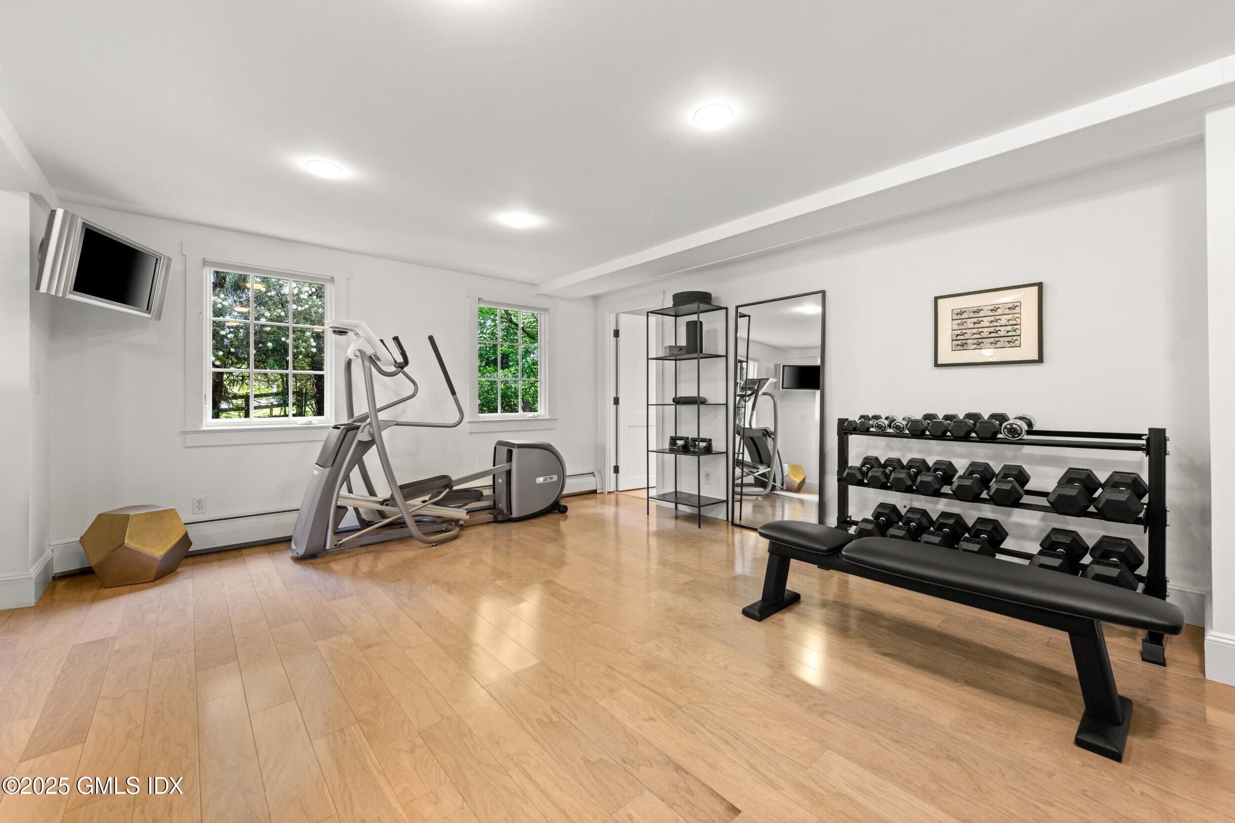 945 Oenoke Ridge New Canaan, CT 06840 - Photo 60 of 94 a view of a room with gym equipment