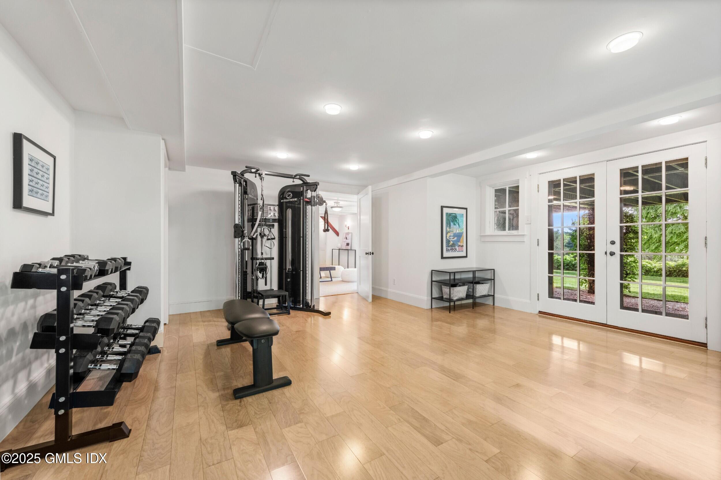 945 Oenoke Ridge New Canaan, CT 06840 - Photo 61 of 94 a view of a room with gym equipment and a large window