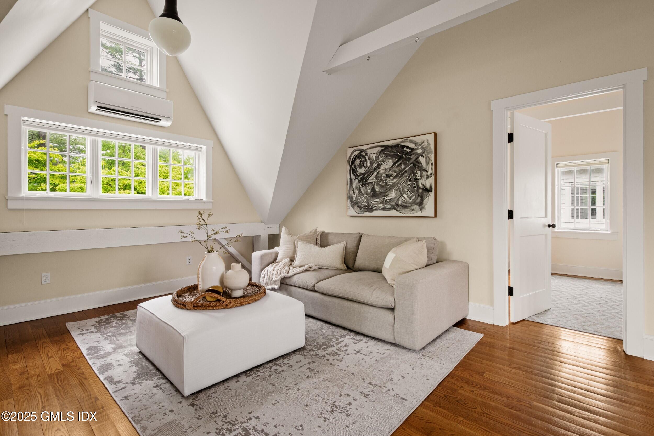945 Oenoke Ridge New Canaan, CT 06840 - Photo 66 of 94 a living room with furniture and a window
