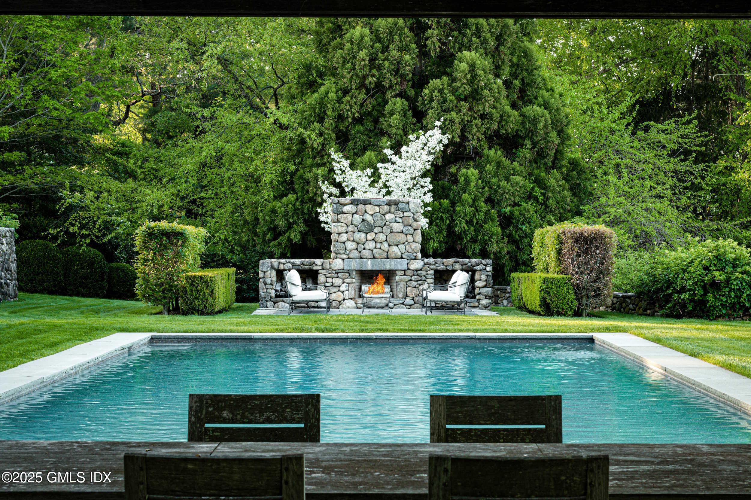 945 Oenoke Ridge New Canaan, CT 06840 - Photo 76 of 94 a view of a water fountain and a big yard
