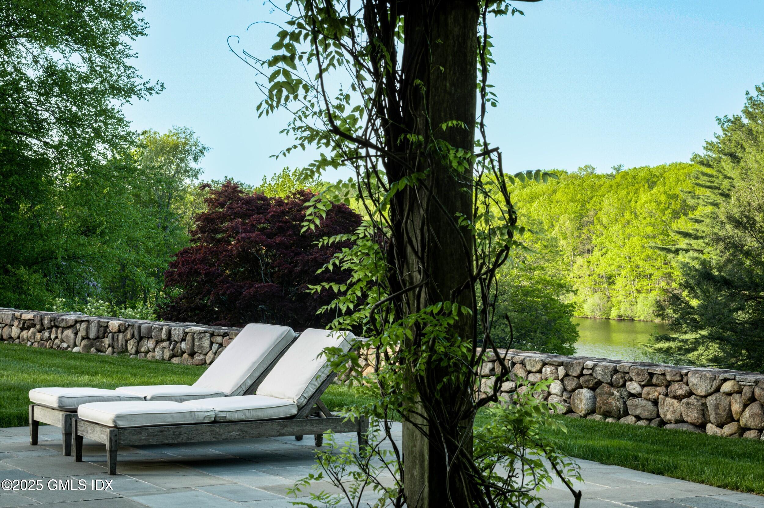 945 Oenoke Ridge New Canaan, CT 06840 - Photo 78 of 94 a view of a two chairs in a patio