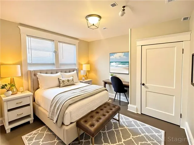 a bedroom with a bed and a window