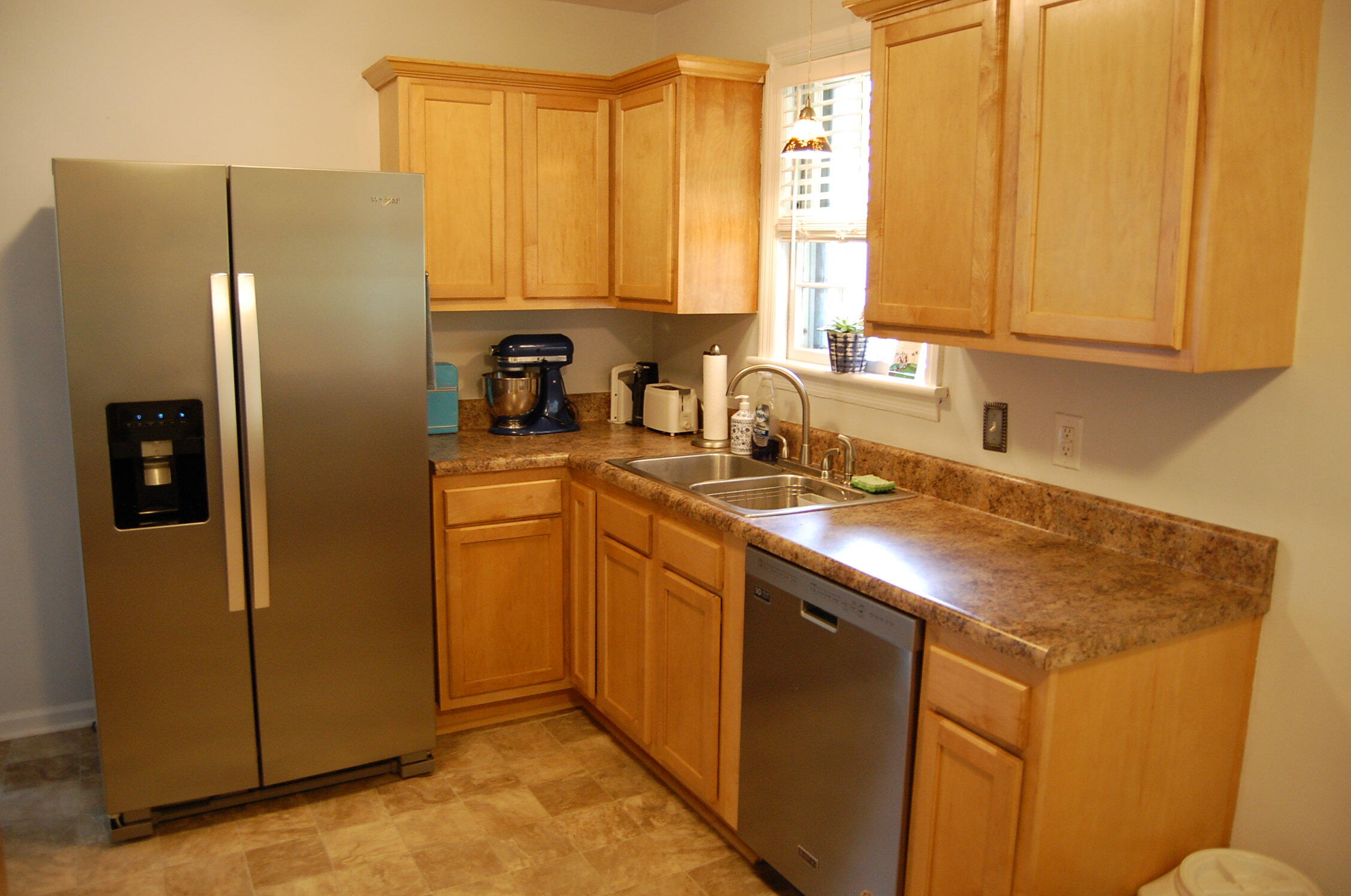 2707 Spring Road Southwest Roanoke, VA 24015 - Photo 3 of 23 a kitchen with stainless steel appliances granite countertop a stove a refrigerator and a sink