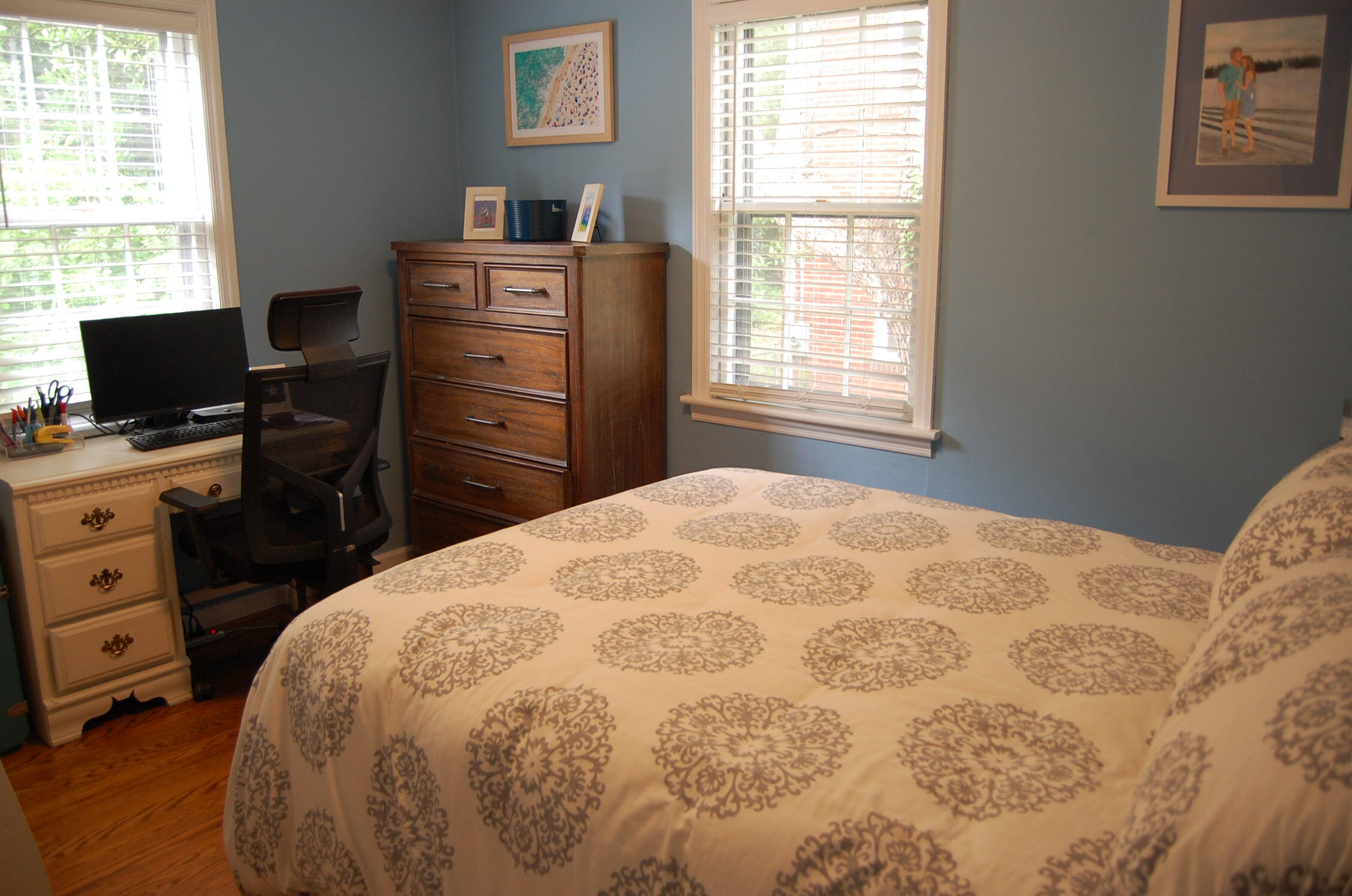 2707 Spring Road Southwest Roanoke, VA 24015 - Photo 8 of 23 a bedroom with a bed and a flat tv screen on the dresser