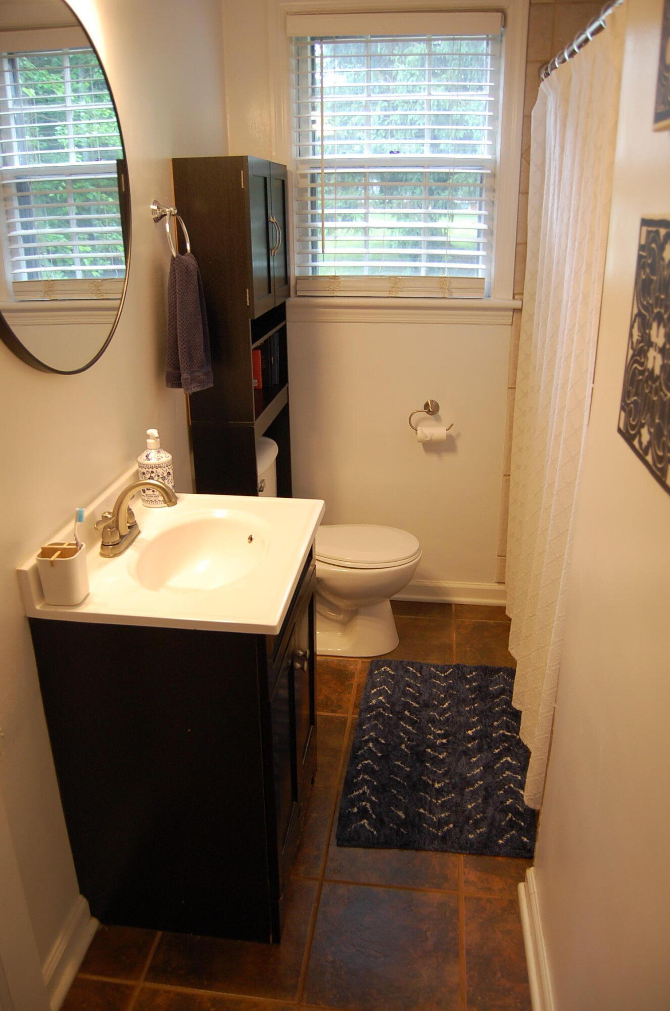 2707 Spring Road Southwest Roanoke, VA 24015 - Photo 9 of 23 a bathroom with a sink toilet and mirror