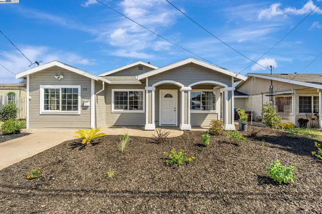 a front view of a house with garden