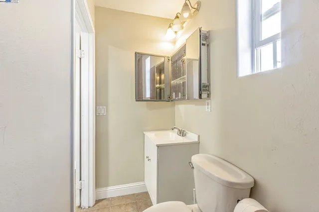 a white toilet sitting next to a bathroom sink