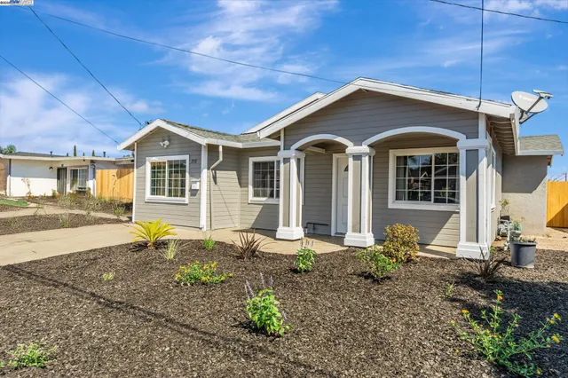 a front view of a house with garden
