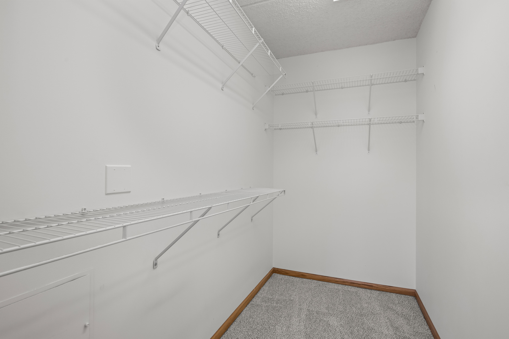 750 Pearson Street, Unit 812 Des Plaines, IL 60016 - Photo 14 of 15 a view of a room with racks on the wall