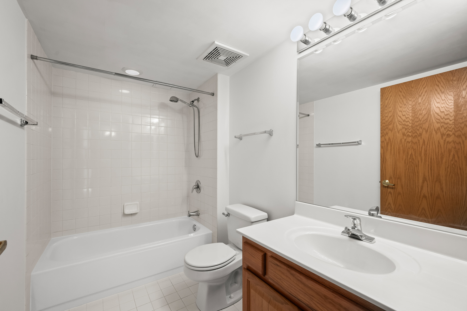 750 Pearson Street, Unit 812 Des Plaines, IL 60016 - Photo 15 of 15 a bathroom with a sink toilet and shower