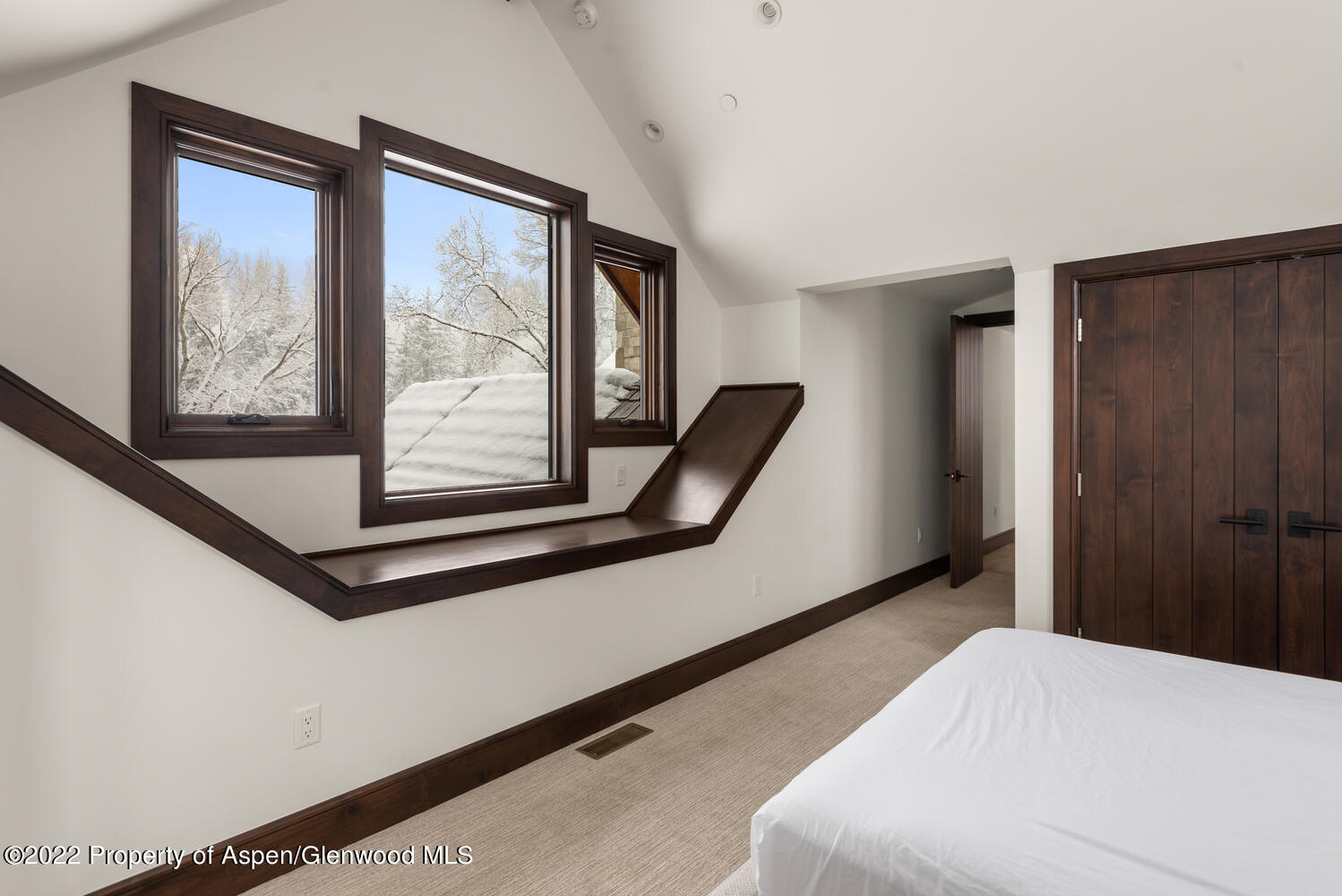 80 River Bend Road Snowmass, CO 81654 - Photo 24 of 39 a bedroom with a bed and large window