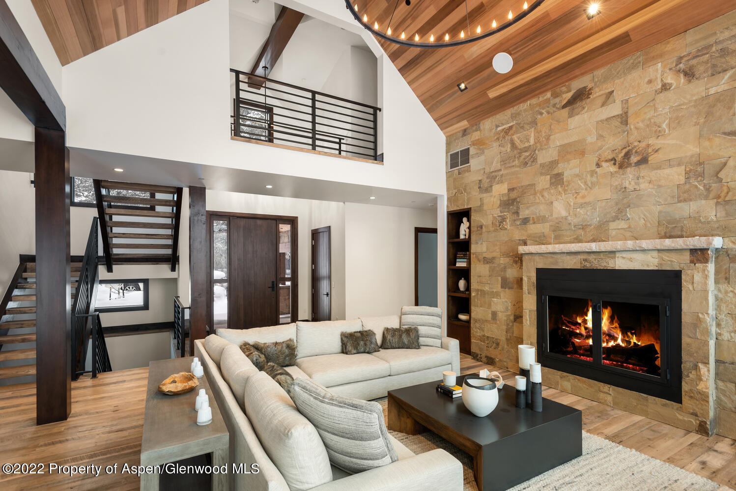 80 River Bend Road Snowmass, CO 81654 - Photo 5 of 39 a living room with furniture and a fireplace