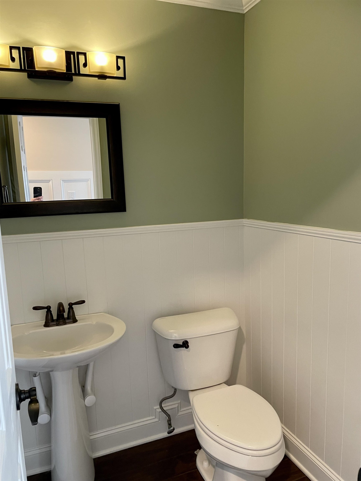 128 Deerview Drive Willow Spring, NC 27592 - Photo 17 of 34 a bathroom with a toilet sink and mirror