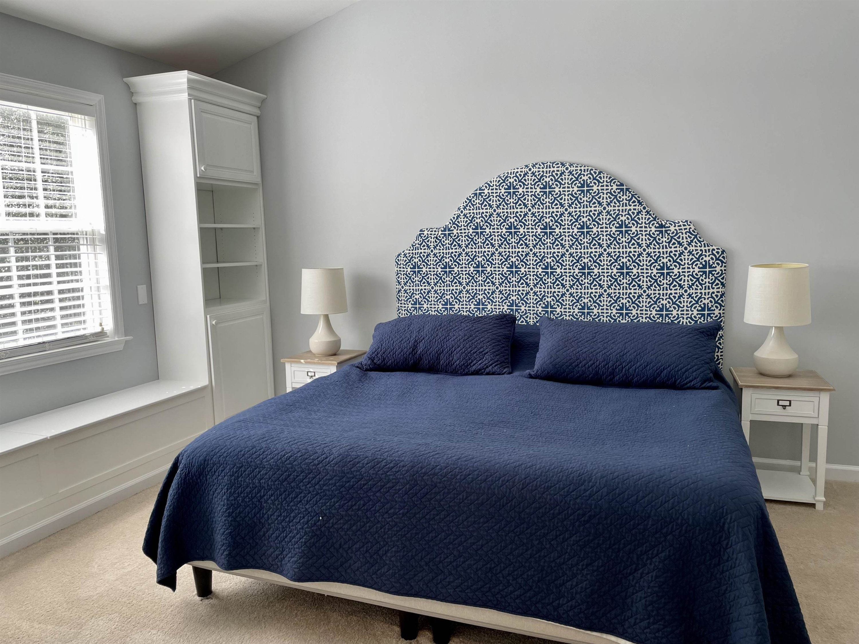 128 Deerview Drive Willow Spring, NC 27592 - Photo 18 of 34 a bedroom with a bed and a window