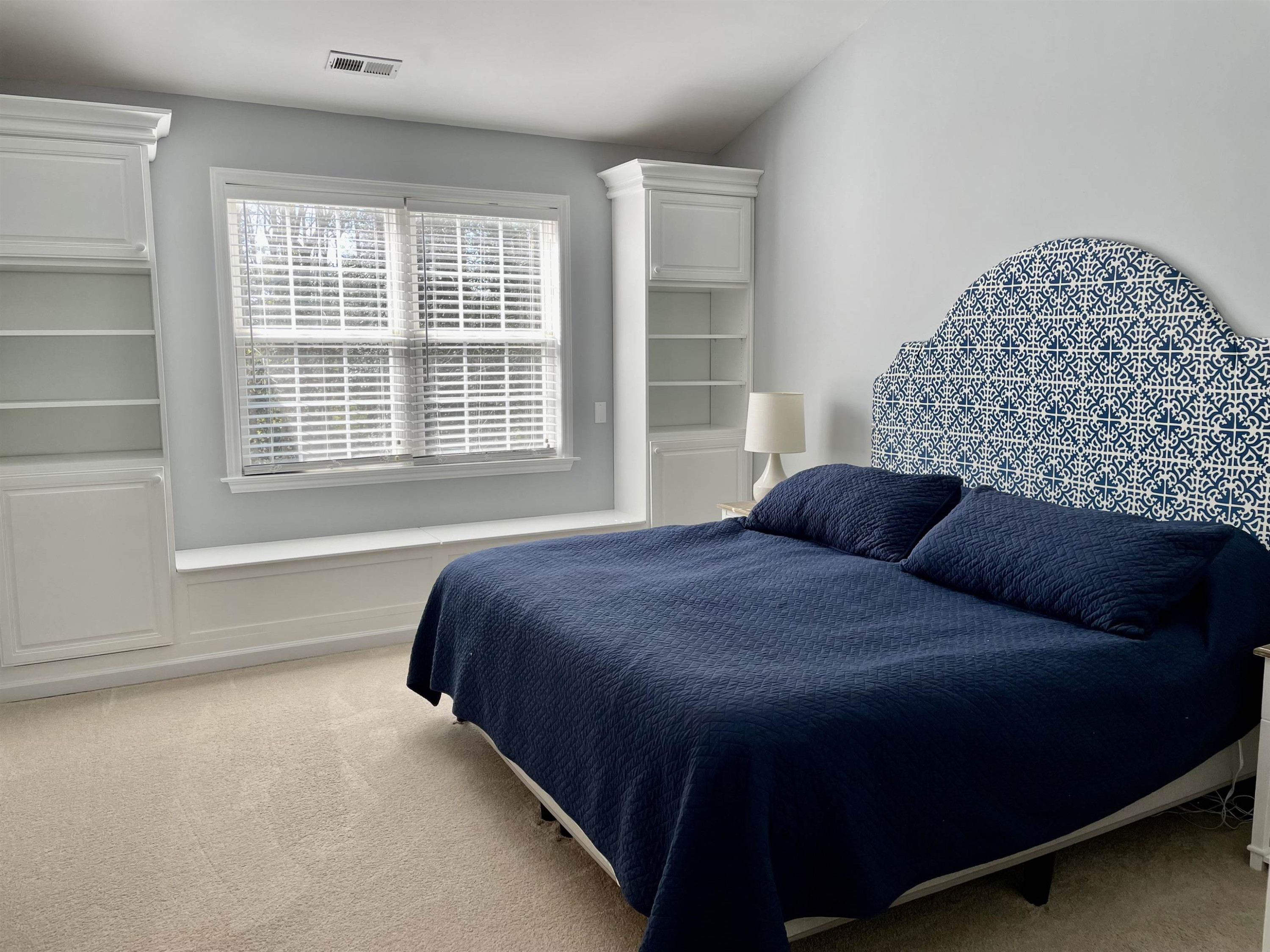 128 Deerview Drive Willow Spring, NC 27592 - Photo 19 of 34 a bedroom with a bed next to a window