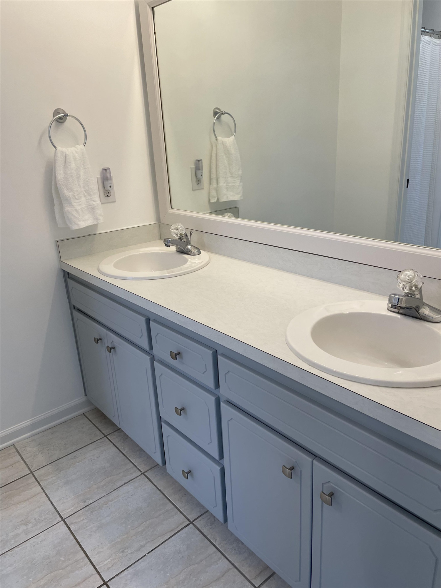 128 Deerview Drive Willow Spring, NC 27592 - Photo 21 of 34 a bathroom with a sink and a mirror