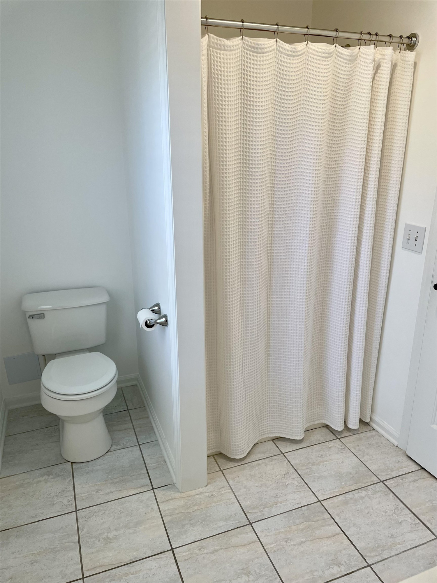 128 Deerview Drive Willow Spring, NC 27592 - Photo 22 of 34 a bathroom with a toilet and a shower curtain