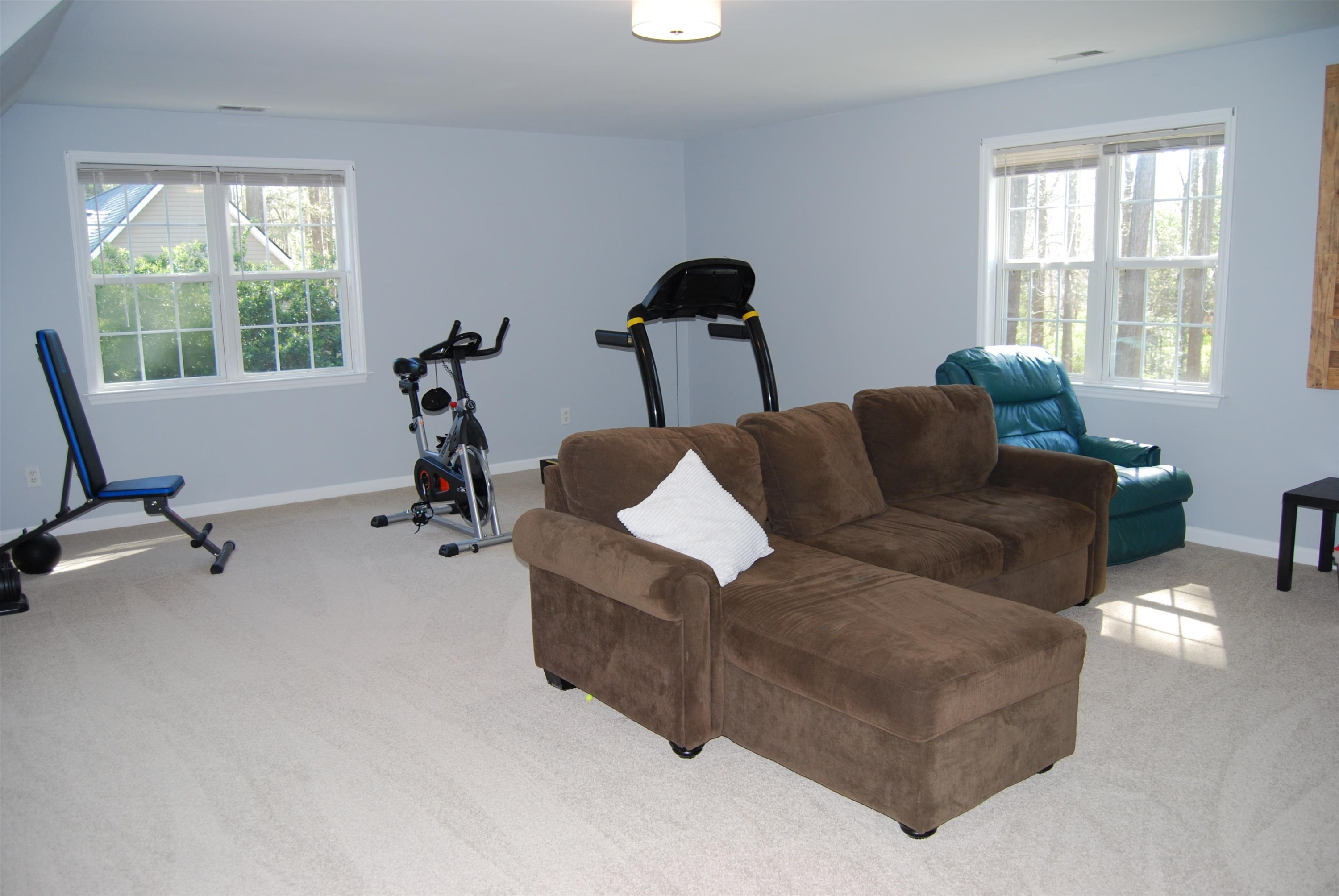128 Deerview Drive Willow Spring, NC 27592 - Photo 28 of 34 a living room with furniture and a window