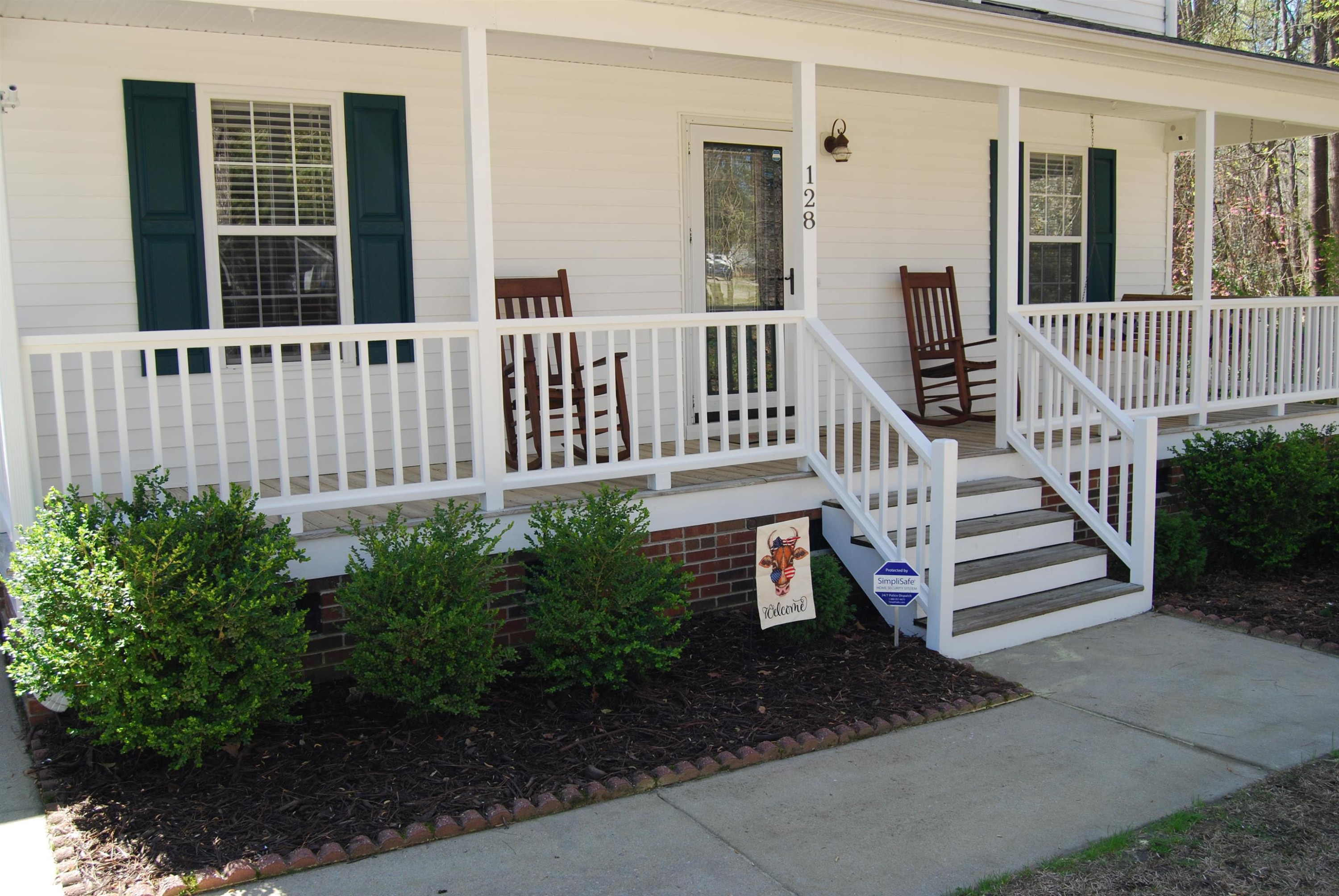128 Deerview Drive Willow Spring, NC 27592 - Photo 3 of 34 front view of a house with a deck