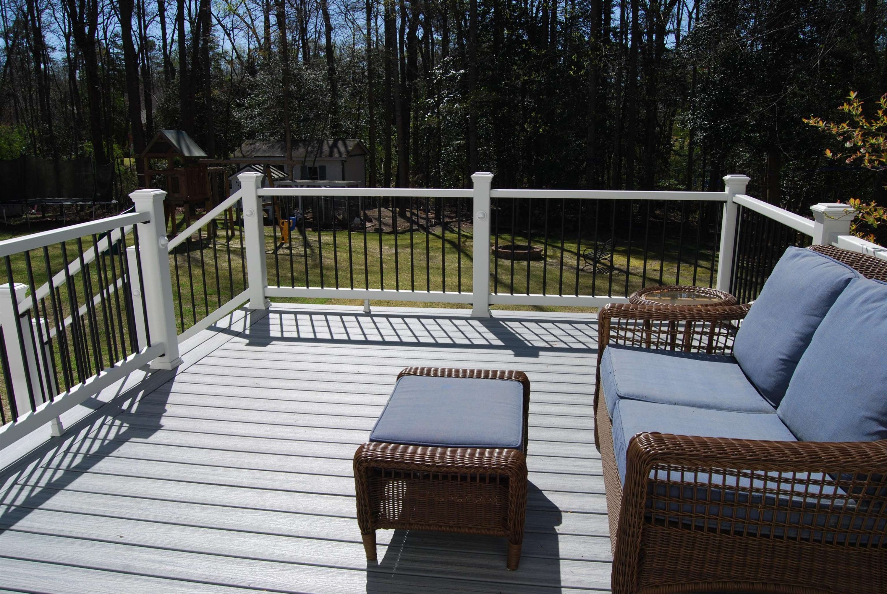 128 Deerview Drive Willow Spring, NC 27592 - Photo 32 of 34 a balcony with wooden floor table and chairs