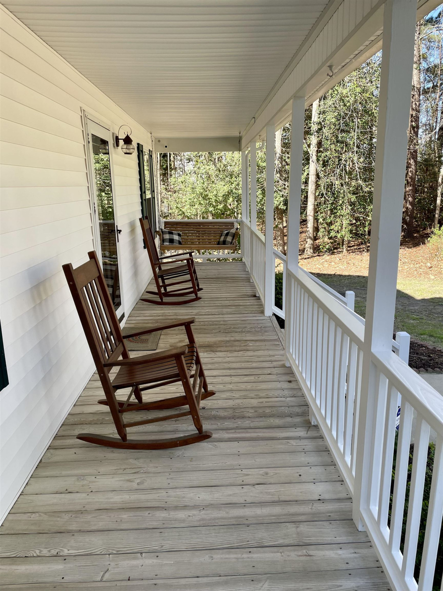 128 Deerview Drive Willow Spring, NC 27592 - Photo 4 of 34 a view of a two chairs in the balcony
