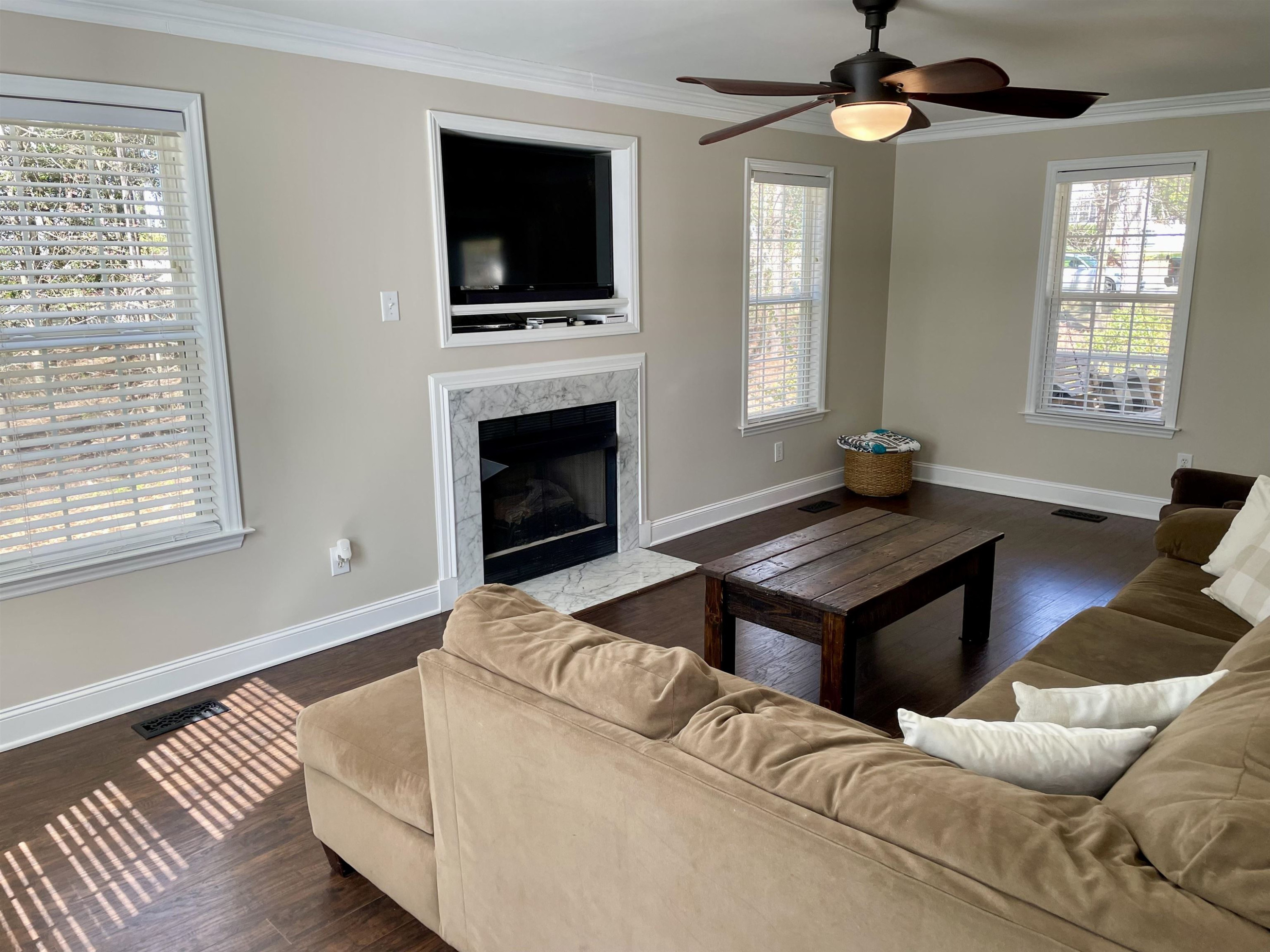 128 Deerview Drive Willow Spring, NC 27592 - Photo 10 of 34 a living room with furniture a flat screen tv and a fireplace
