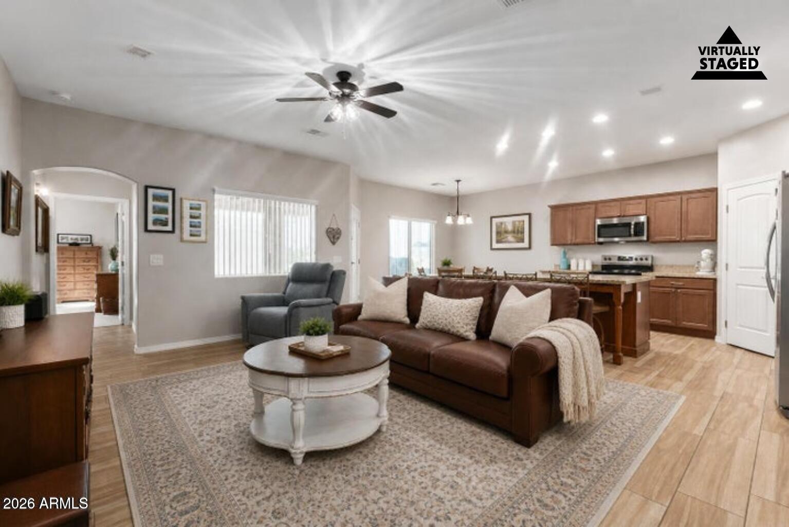 614 North Tomahawk Road Apache Junction, AZ 85119 - Photo 4 of 44 a living room with furniture and a view of kitchen