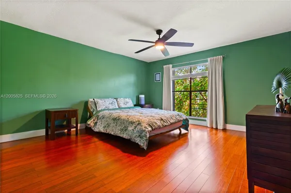 a bedroom with a bed and a table