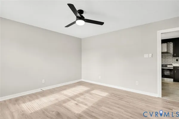 a view of an empty room with a window