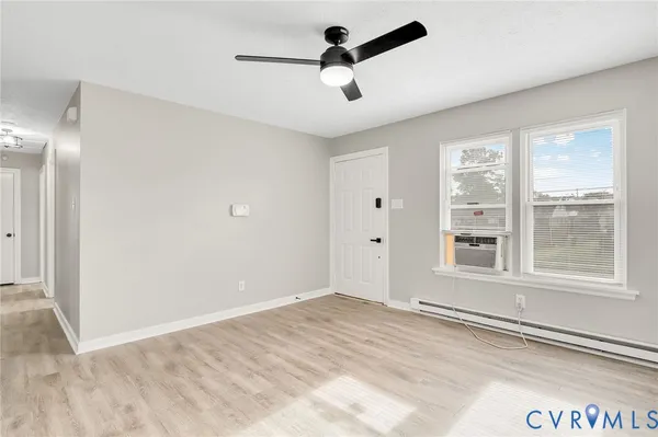 a view of an empty room with a window