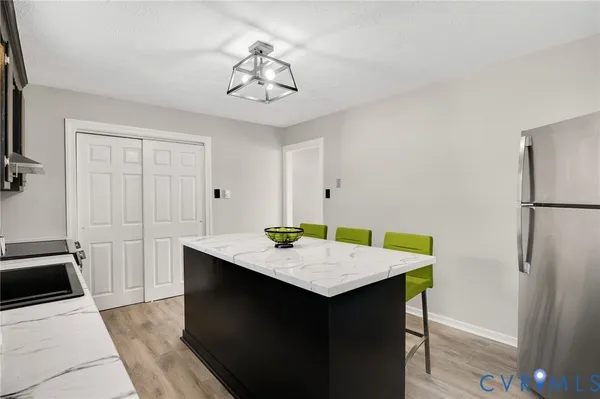 a kitchen that has a sink and a stove