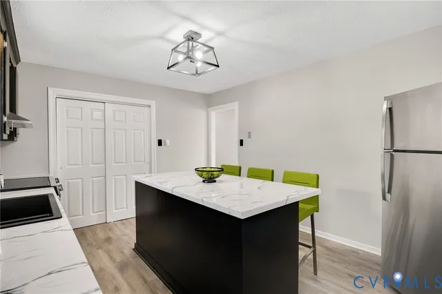 a kitchen that has a sink and a stove