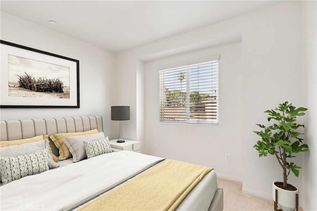 12106 Old River School Road, Unit G Downey, CA 90242 - Photo 12 of 22 a bedroom with a large bed and a potted plant