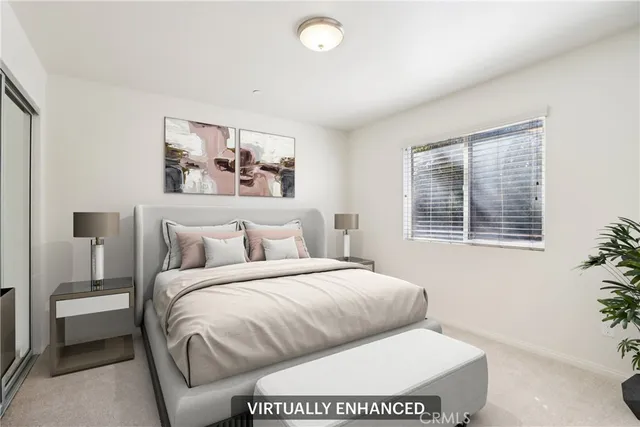 a bedroom with a large bed and a window