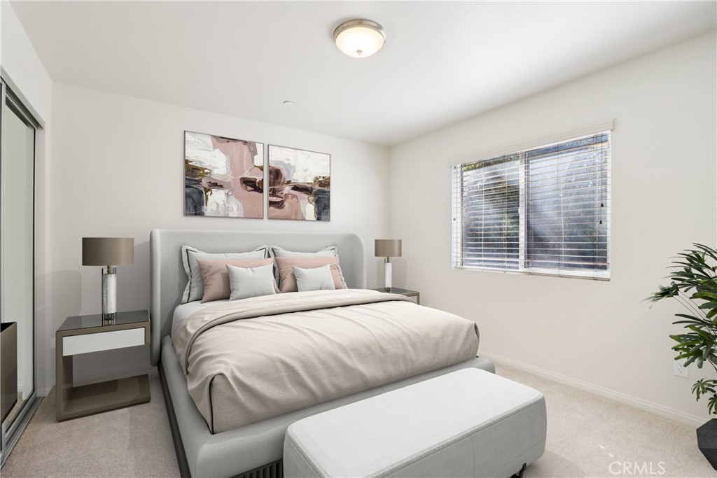 12106 Old River School Road, Unit G Downey, CA 90242 - Photo 15 of 22 a bedroom with a large bed and a window