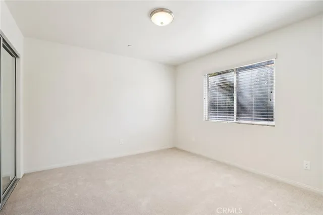 a balcony with furniture and a potted plant