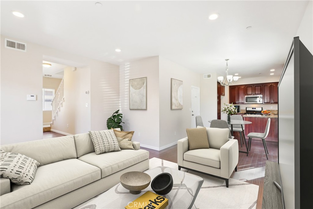 12106 Old River School Road, Unit G Downey, CA 90242 - Photo 3 of 22 a living room with furniture and a view of kitchen