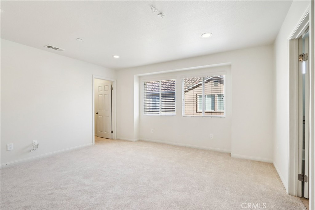 12106 Old River School Road, Unit G Downey, CA 90242 - Photo 9 of 22 an empty room with windows