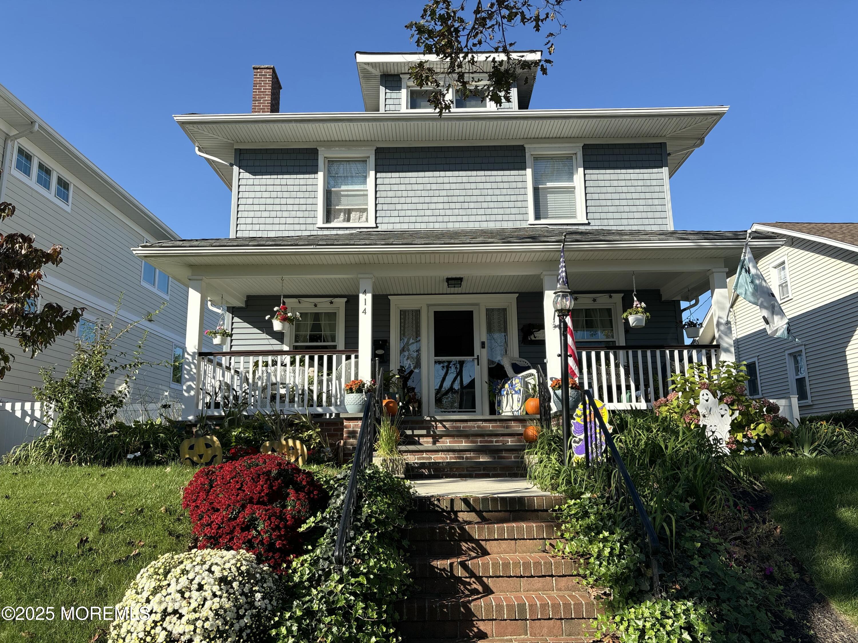 414 Washington Avenue Avon-by-the-Sea, NJ 07717 - Photo 1 of 19 a front view of a house with a yard