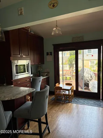 a living room with furniture and large windows
