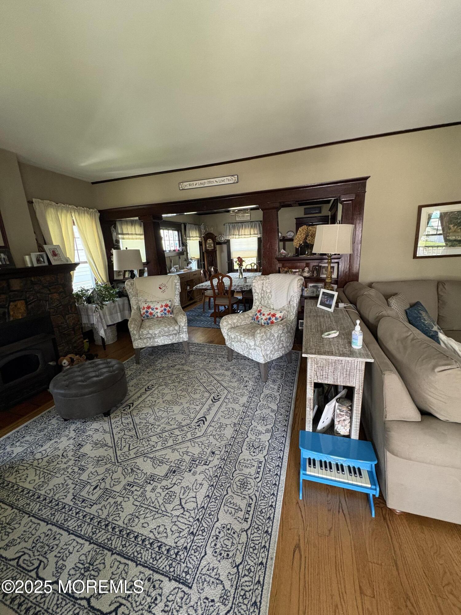 414 Washington Avenue Avon-by-the-Sea, NJ 07717 - Photo 19 of 19 a living room with furniture and a wooden floor