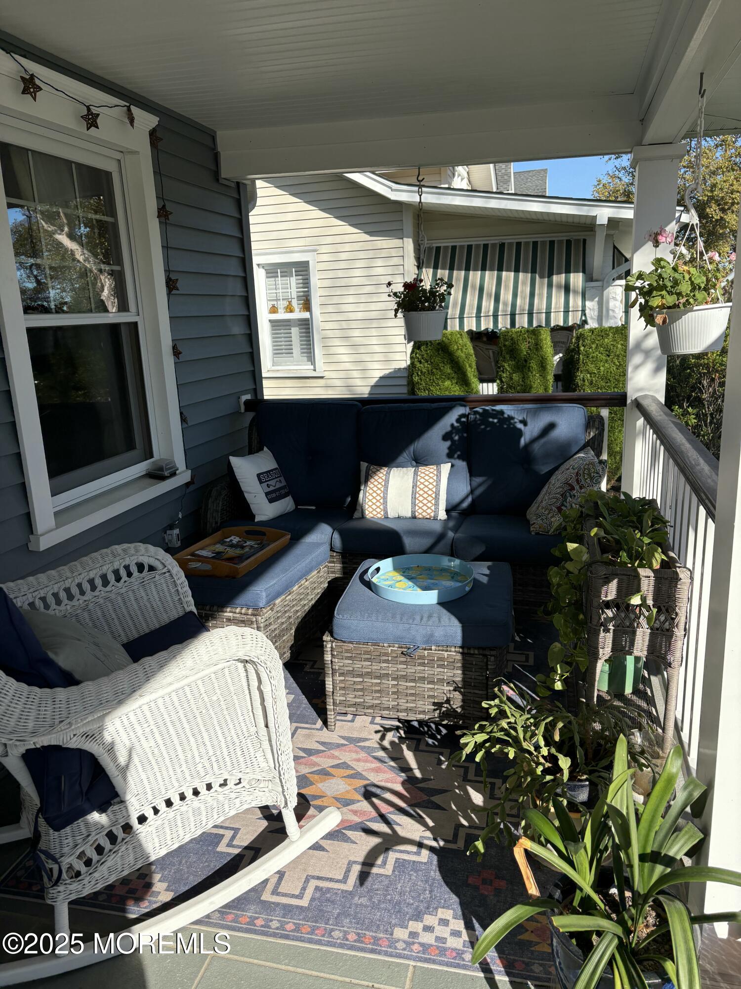 414 Washington Avenue Avon-by-the-Sea, NJ 07717 - Photo 3 of 19 a living room with furniture and a potted plant