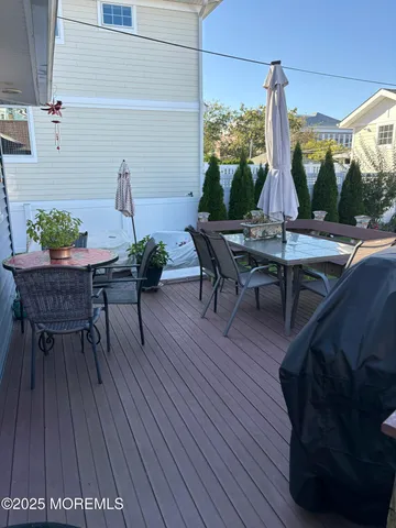 a view of a chairs and table in the balcony