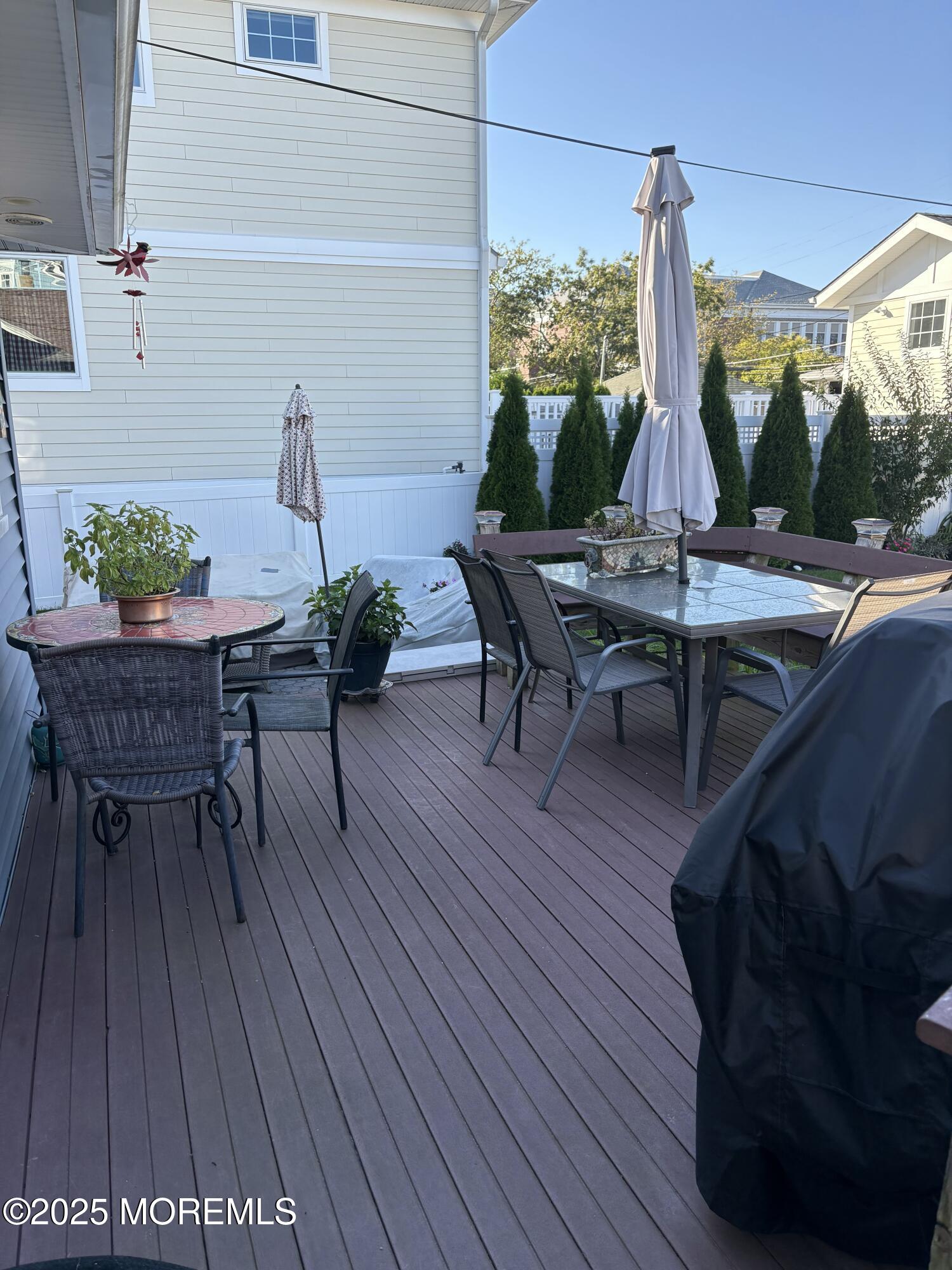 414 Washington Avenue Avon-by-the-Sea, NJ 07717 - Photo 5 of 19 a view of a chairs and table in the balcony