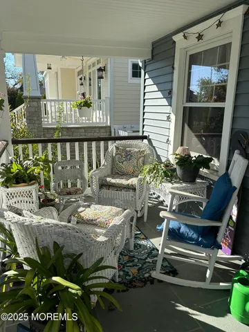 a outdoor living space with patio furniture and potted plants
