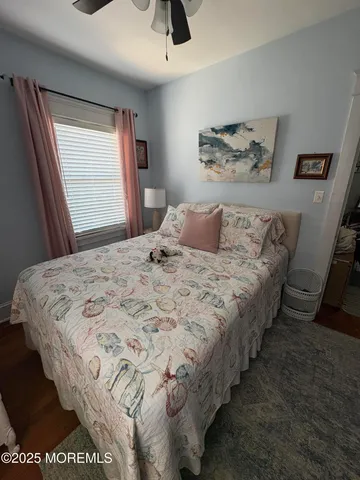 a bedroom with bed and window