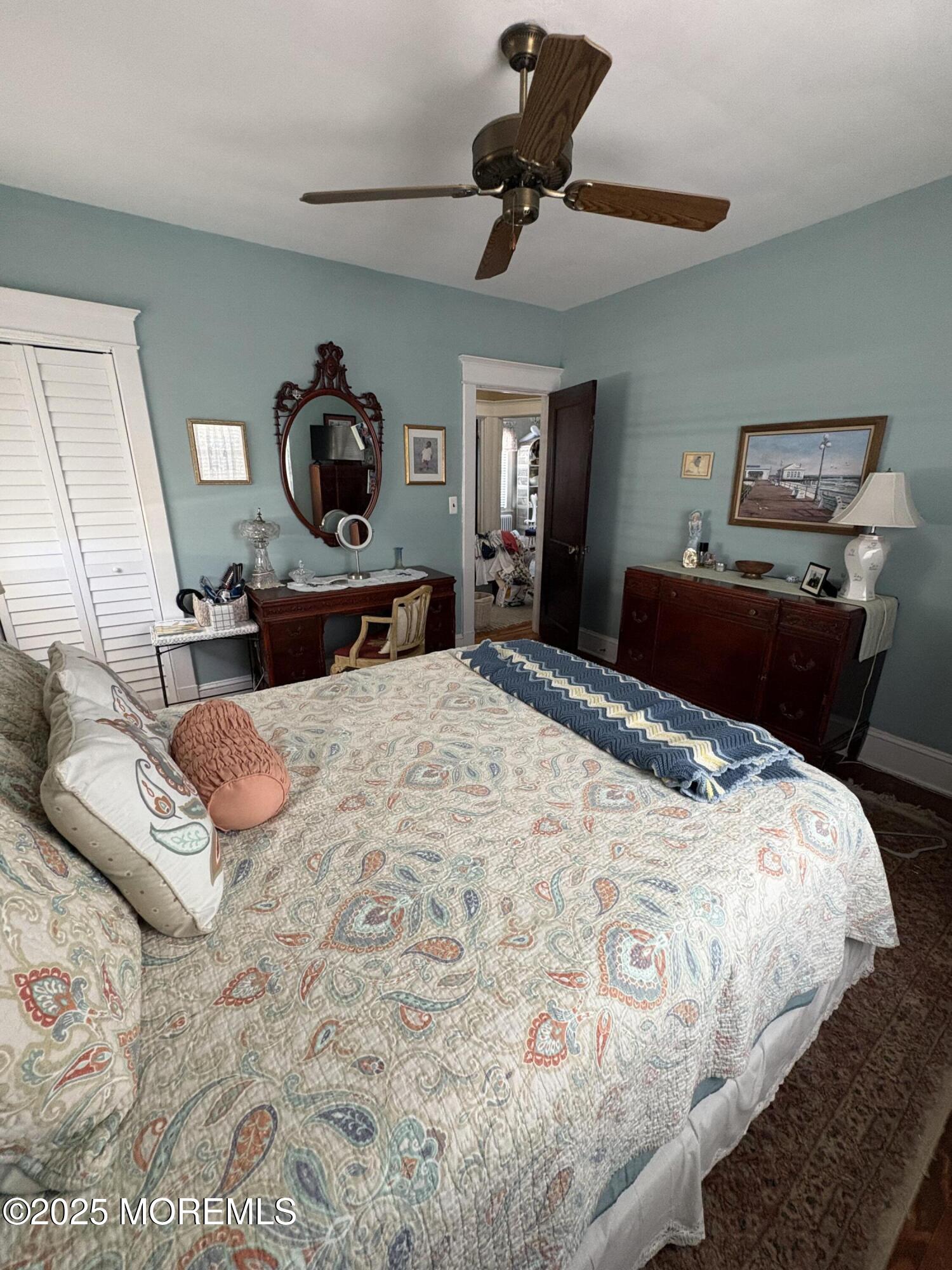 414 Washington Avenue Avon-by-the-Sea, NJ 07717 - Photo 8 of 19 a bedroom with a bed and a dresser