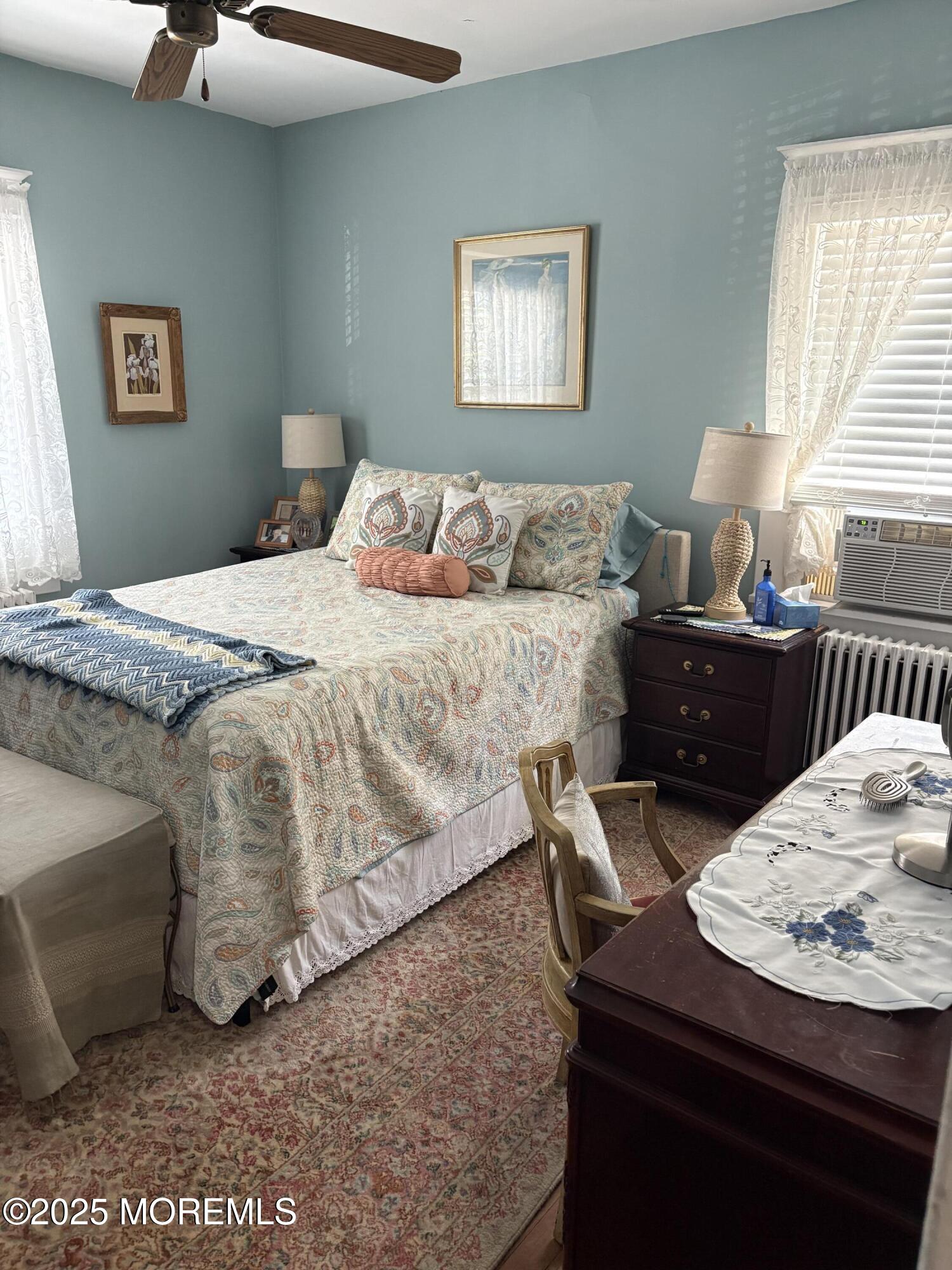 414 Washington Avenue Avon-by-the-Sea, NJ 07717 - Photo 9 of 19 a bedroom with a bed and a couch